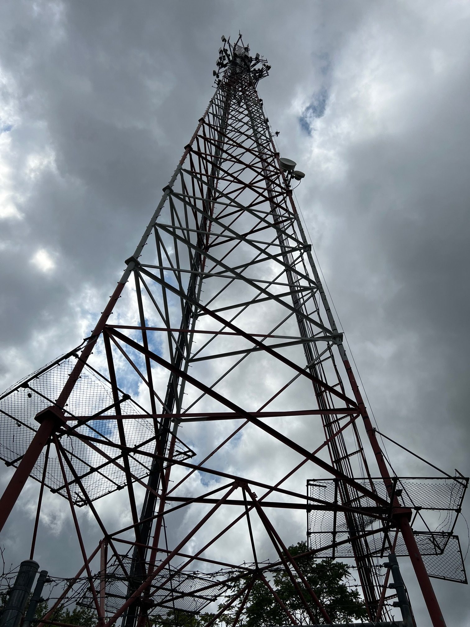 Communications and microwave tower against a dramatic sky